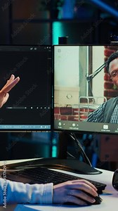 Vertical video Woman doing software debugging helped by coworker in videocall, checking errors in lines of code. Programmer working from home fixing coding mistakes, assisted by colleague in