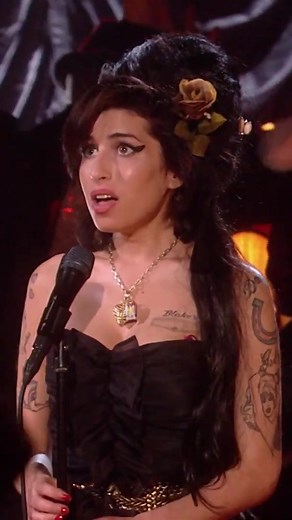 Amy winning Record of The Year for 'Rehab' at the Grammys in 2008. | amy winehouse's grammy