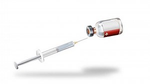 Syringe drawing liquid from a medical vial