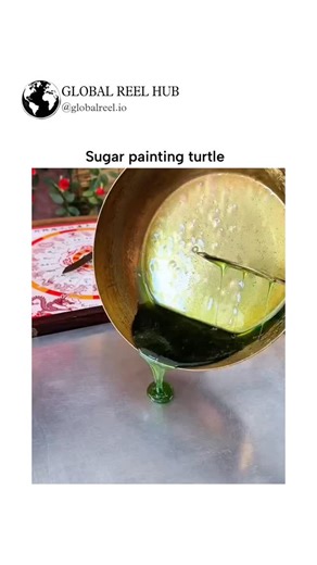 GLOBAL REEL HUB on Instagram: "The post features a 18-second video demonstrating traditional sugar painting of a green turtle, using molten sugar poured and shaped with ladles and spatulas on a metal surface, set against festive Chinese decor. Sugar painting, or tánghuà, traces to China's Tang Dynasty as a folk art for creating edible figurines; turtles symbolize longevity and the mythical Black Tortoise (Xuanwu), blending artistry with cultural auspiciousness. High engagement from Indonesian us