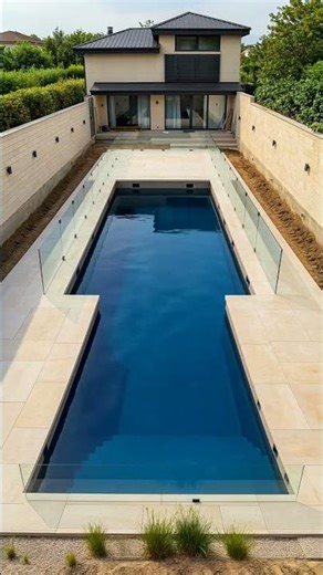 timelapse of enclosed luxury home backyard transforming into sleek rectangular infinity-edge pool.