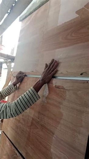 Install the aluminum shadow line on the granite wall grout