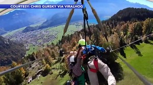 VIDEO: Hang-gliding mishap leaves man holding on for dear life