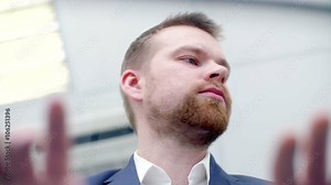 businessman typing on an invisible keyboard. shoot from below