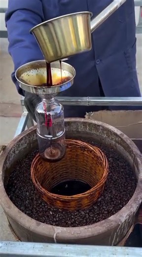 the process of pouring soy sauce into bottles#shorts