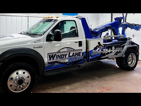 Wrapping a Tow Truck with a custom printed wrap.