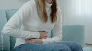 stomach ache. Asian women have abdominal pain, indigestion, gastritis, menstrual cramps, flatulence, diarrhea, distention, colon cancer, belly inflammation problem, suffer food poisoning, abdomen