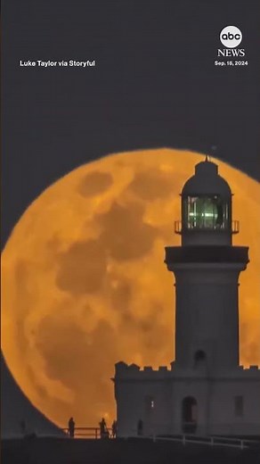 Supermoon rises behind historic Australian lighthouse