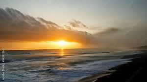 Dramatic Sky with Dark Stormy Gray Clouds Over the Sea at Sunset