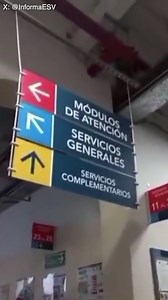 Signs hanging from the ceiling swing back and forth