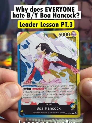 Why does EVERYONE hate Boa Hancock? In this Leader Lessons episode, we break down the OP-14 Boa Hancock Leader and explain why she’s one of the most frustrating Leaders to face in the One Piece Trading Card Game. Boa Hancock is a Blue/Yellow Leader with 4 Life and 5000 Power, and her effects punish opponents for simply playing the game. From drawing cards every time she plays a Character on your turn, to forcing you to take Life when you K.O. her key Amazon Lily and Kuja Pirates characters, Boa 