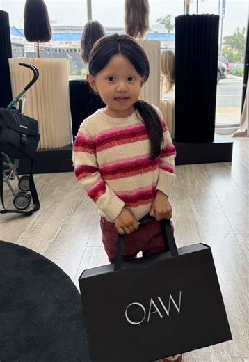 A mother's love turned into something so much bigger than hair. 🫂 Mom donated 14 inches of her own hair so her 3-year-old daughter with alopecia could have hair again not just a wig, but confidence, joy, and the freedom to feel like herself. Watching her smile, play, and light up seeing all the princess hairstyles she can now wear... this is why we do what we do. At Hair With A Cause, identity has no age limit. ❤️ We can create a custom wig using your own hair so it looks, feels, and belongs to