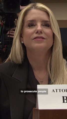 Giant Donald Trump banner hangs outside Justice Department headquarters