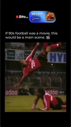 CLIP BUZZ . X on Instagram: "The player in the red kit is Guillaume Deschamps, playing for the French club EA Guingamp against Lyon during the 2002–2003 season. @bitzcasino While the footage looks incredibly authentic, the 360-degree mid-air rotation is actually a digital edit added long after the match ended. In the original game, Deschamps went for a standard header and missed as the goalkeeper cleared the ball. Despite being a CGI creation, it remains one of the most famous viral hoaxes in fo
