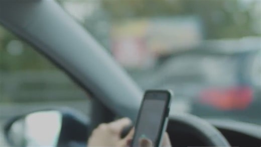 Holding your cellphone while driving in California is now illegal