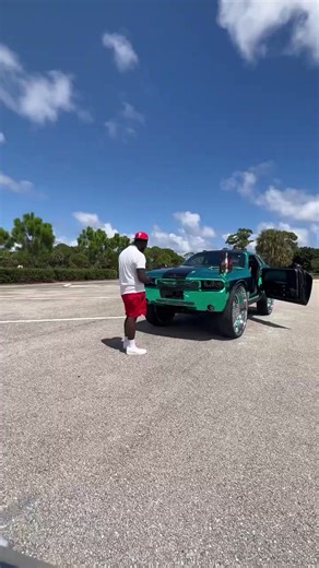 Crazy chrome teal Challenger on big 34”s