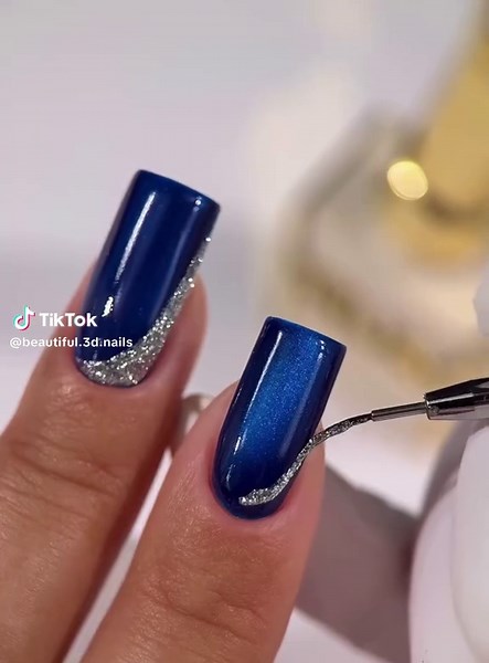 Blue cat eye. Tutorials on trendy nail art designs go viral due to visual appeal and creative variety. Trending Nail Art Ideas, Beautiful Nail Designs Tutorial, Simple Nail Art Hacks #creatorsearchinsights #christmasnail #christmasnails #winternails #nails