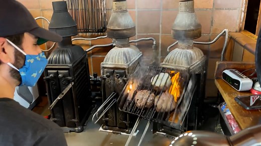 I visit Louis’ Lunch in New Haven, Connecticut — the birthplace of the hamburger — to try the original burger recipe that started it all. Cooked in cast-iron grills from 1898 and served on toasted bread, this is a bite of American food history. #OriginalBurger #LouisLunch #FirstHamburger #FoodHistory | Strictly Dumpling
