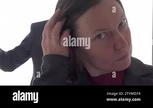 Husband and wife getting dressed for work and talking in front of the mirror, frontal view Stock Video Footage - Alamy