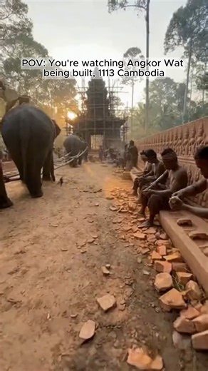ai.history77 on Instagram: "POV: You're watching Angkor Wat being built, 1113 Cambodia 🐘 Elephants haul multi-ton sandstone blocks. Stonemasons hand-carve apsara dancers into stone. 40-foot bamboo scaffolding rises as laborers climb with ropes and pulleys. No cranes. No machinery. Just human hands and animal power. This took 30+ years to build. Which ancient construction site should I show next? 👇 #aihistory77 #pov #historytok #timetravel #aihistory #history #angkorwat #cambodia"