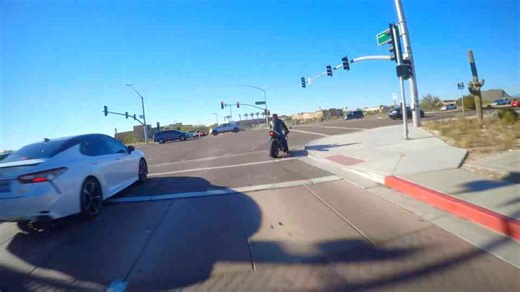 Reckless car drivers cutting off motorcycles, running lights, and creating dangerous road conditions