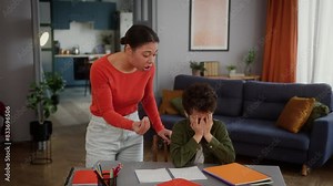 African American family little boy child kid son studying home education homework mistake problem cry close face with hands crying mad furious shouting angry mother woman female talking dissatisfied