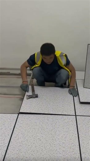 the process of installing ceramic tiles on a light steel frame on the floor of the room #viralshorts
