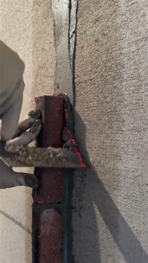 Using a laser level to align bricks on a wall