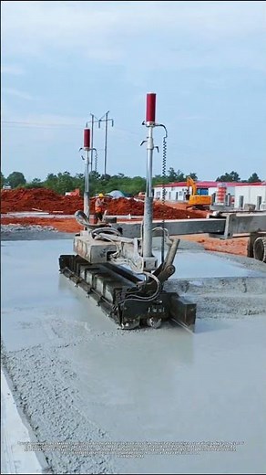 Large laser screed in operation, telescopic arm for large-area floor leveling