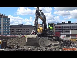 4K| Volvo ECR235E Excavator Digging And Pushing With The Blade