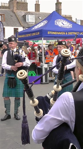 Dunnottar Pipes and Drums, led by Pipe Major Iain McFadden, playing The Banks of Loch Lomond as they entertained crowds during the 2024 Stonehaven Feein' Market. This was held on Saturday 1st June 2024 at Stonehaven in Aberdeenshire, Scotland. Watch for the lovely tenor drum flourishes at the end. The Feein' Market is a wonderful day of music and dancing, with displays by Dunnottar Pipes & Drums and local dance scholls, an outdoor market and lots of entertainment. This is all thanks to the work 