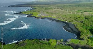 4k aerial hovering view of Punaluu beach,The beach has black sand created by lava flowing into the ocean, also has a large turtle population,Big Island,Hawaii,usa