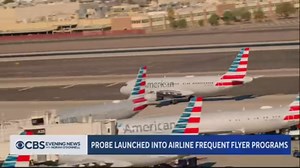 The rewards programs of American, Delta, United, and Southwest Airlines are under federal investigation for how they're affected by extra fees and surge pricing. | CBS Evening News