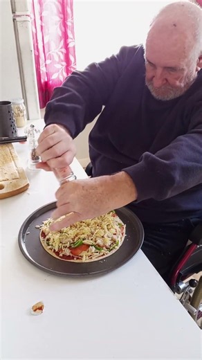 Seasoning pizza with salt and pepper