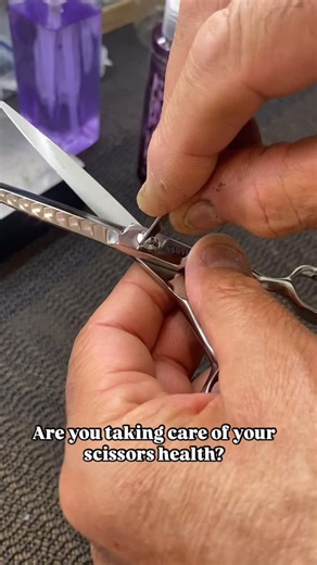 NickVracknos on Instagram: "Your scissors work hard for you — show them some love ✂️🖤 Regular oiling (with the correct scissor lubricants) is one of the simplest (and most important) habits to keep your scissors cutting like new. Here’s how to do it right: ✨ Start with clean scissors — remove hair, moisture and residue ✨ Apply scissor oil to the pivot and lightly to the inside of the blades ✨ Wipe the oil along the inside blade ✨ Open and close the scissors to distribute the oil evenly ✨ Give t