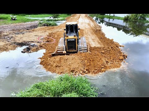 Jaw-Dropping Heavy Machinery: Dozer Pushing Stones into Water for New Road!