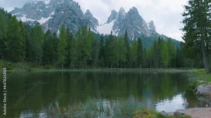 italian alps dolomites national park lake mountain trekking peaks tre cime brais lake carezza lake reflection clouds