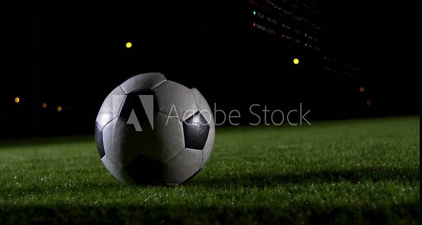 Male player cleat entering, striking soccer ball and sending it rolling for sports analytics graphs
