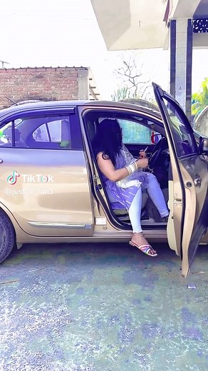 Traditional Outfit Showcase: Woman Exiting Car