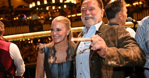 Schwarzenegger directs a band in a beer tent at Munich’s Oktoberfest