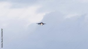 Fighter jet on final approach before landing at airport.