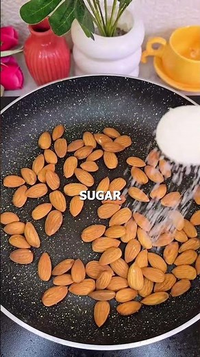 Crunchy homemade almond toffee — roasted almonds, melted sugar, a cube of butter, and roasted sesame