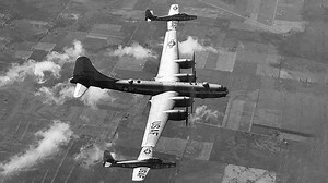 A Bomber with Fighter Jets Stuck on Its Wings