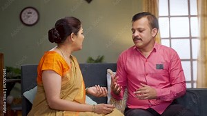 Wife got angry while arguing with husband at home - concept of relationship problems, conflict and unhappy relationship.