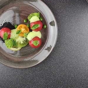 Tomato compote served with fresh heritage tomatoes, basil gel, parsley sponge, wild garlic foam and olive powder | Paintingfood