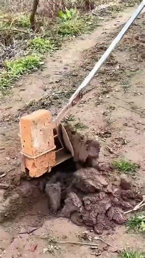 Improvised soil probe using brick and metal rod