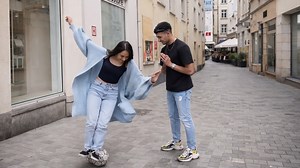 Challenging strangers to balance on a ball in public