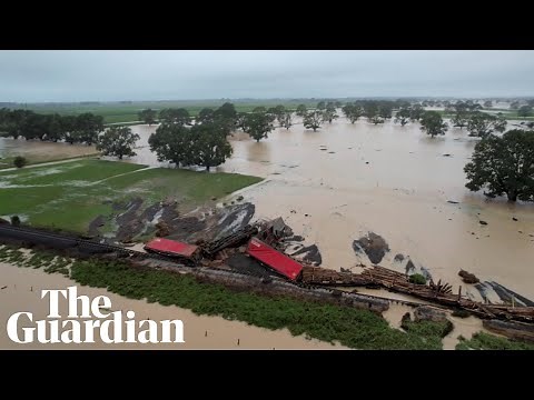 New Zealand floods: drone footage shows derailed train and landslides
