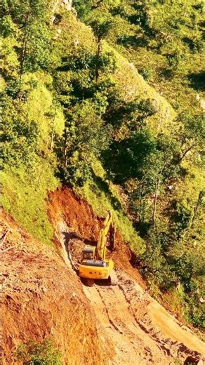 Skillful Excavator Operator Building Mountain Road