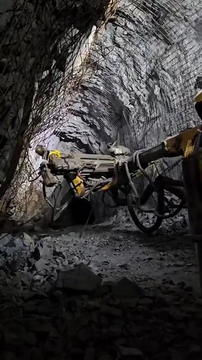 This video demonstrates the process of rock bolting and wire mesh installation in an underground mining project. These ground support techniques are essential for ensuring stability and safety in excavated tunnels and stopes. However, it is important to note that while this video shows the installation of wire mesh before the first layer of shotcrete, this is not considered best practice. The first layer of shotcrete should always be applied before installing wire mesh to ensure that personnel d